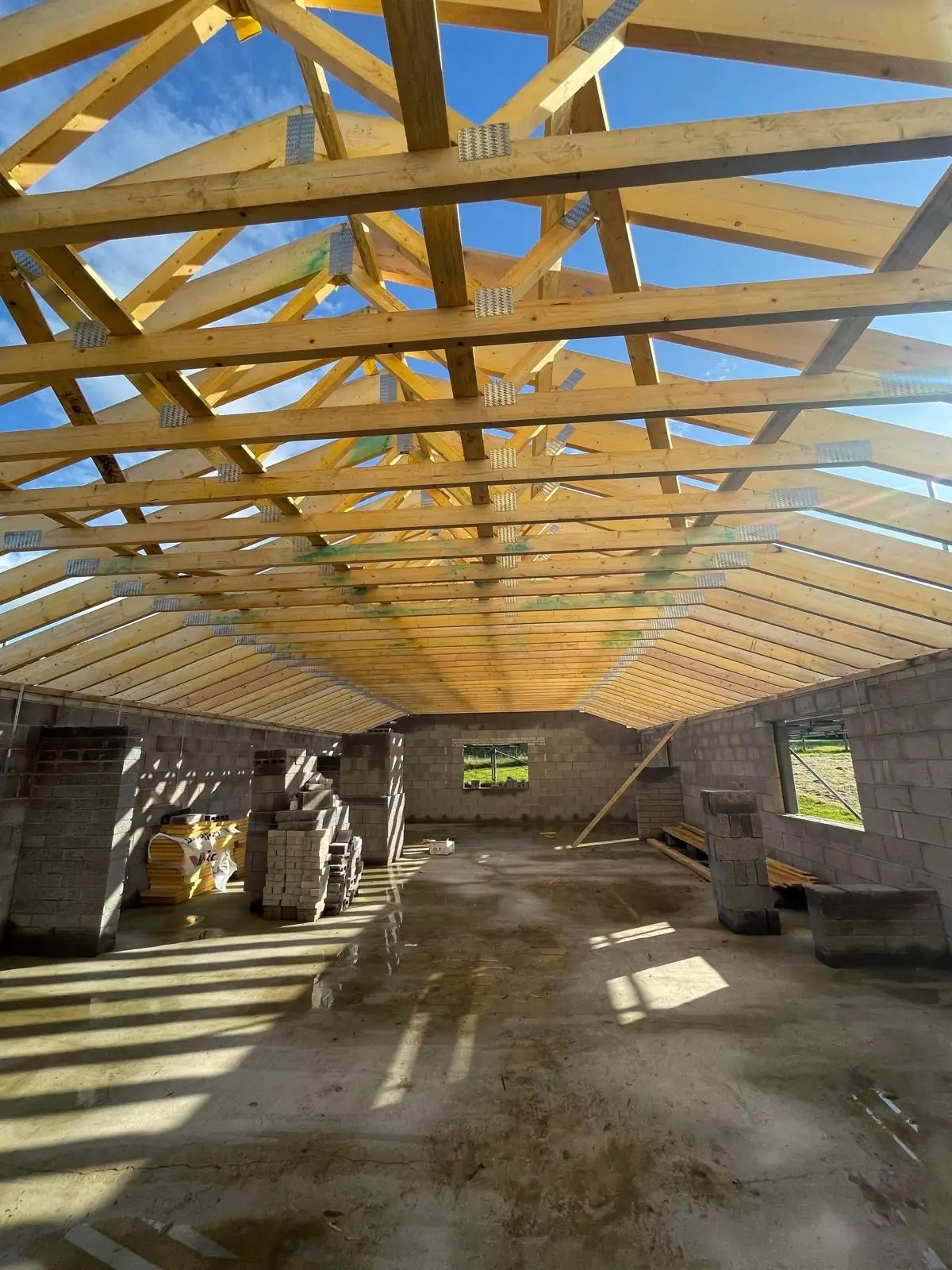 Timber roof trusses up on a block-built new build. One of our jobs.
